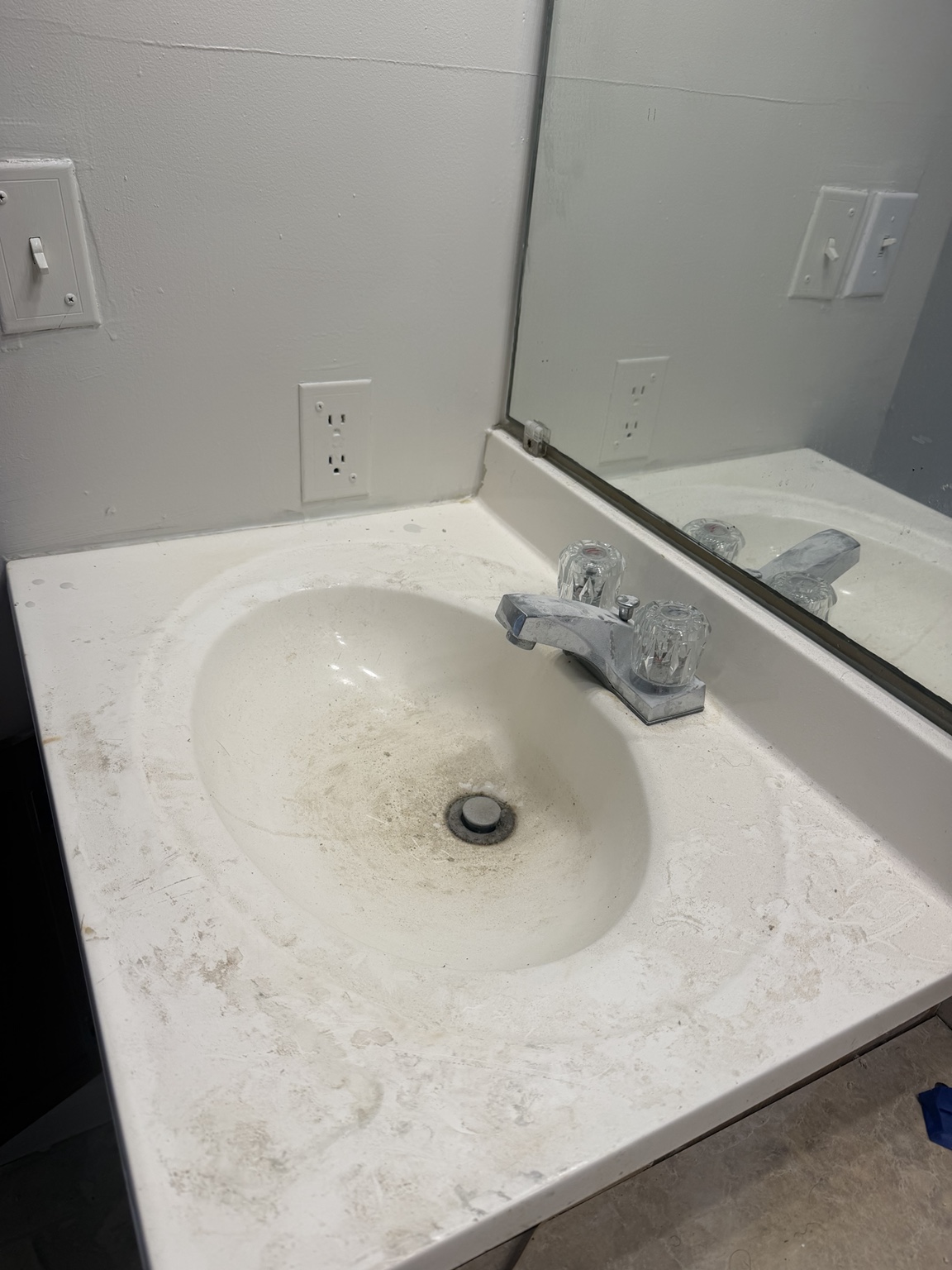 Dirty bathroom sink before cleaning